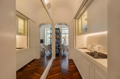 a kitchen with a sink and a counter top at Clerigos 82 luxury Housing in Porto
