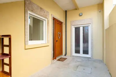an empty room with a door and a window at VIVA Bonfim Cozy Home in Porto