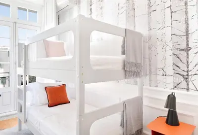 a white bunk bed in a room with a window at Historical Penthouse at Cardosas Block in Porto