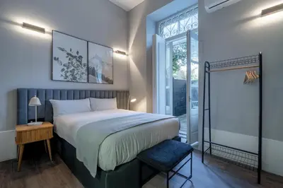 a bedroom with a bed and a window at Limehome Porto Rua de Dom Manuel II in Porto