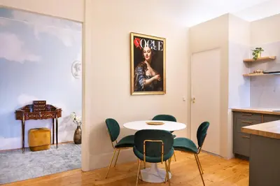 a kitchen and dining room with a table and chairs at Cardosas Gem - Historic ap 1F in Porto