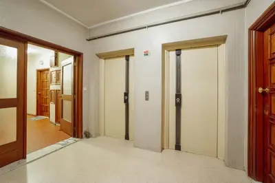 an empty hallway with doors and a room with a hallway at Pateo In Lapa City Center by Vacationy in Porto