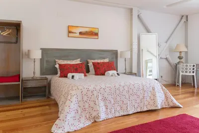 a bedroom with a bed with two towels on it at Capim Dourado Apartments Cedofeita in Porto
