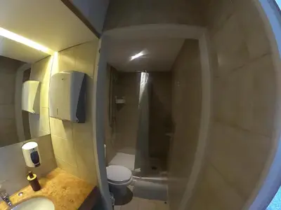 a bathroom with a shower and a toilet and a sink at Santa Catarina´s Soul in Porto