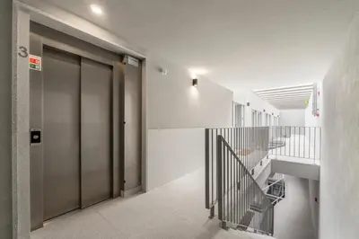 a hallway with a staircase in a building at GuestReady - Elegant living in Porto city centre in Porto