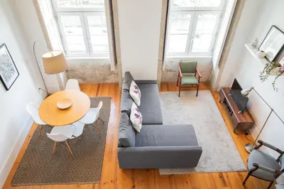 a living room with a couch and a table at Santo António Loft - Porto Perfect in Porto