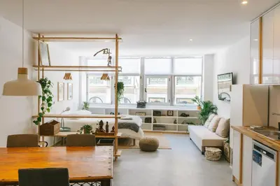 a room with a loft bed and a living room at Porto Serenity loft. in Porto