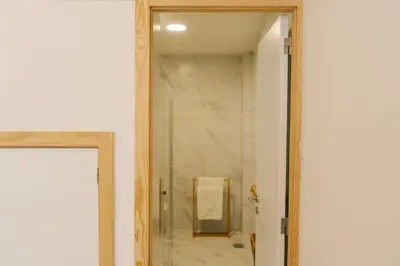 a bathroom with a mirror and a walk in shower at Porto Serenity loft. in Porto