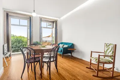 a dining room with a table and chairs at Belly Angel Apartment in Porto