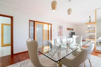 a dining room with a glass table and chairs at Host Wise - Gorgeous Spacious Flat - Ace Location in Porto