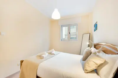 a bedroom with a bed with two towels on it at GuestReady - A pleasant stay in Porto in Porto