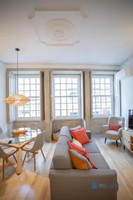 a living room with a couch and a table at Porto Almada Design Loft in Porto