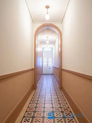 an empty hallway with a door and a tile floor at Porto Almada Design Loft in Porto