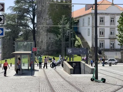 a group of people walking around a city at OPO Domus in Porto