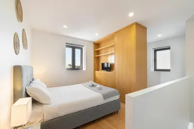 a bedroom with a bed and a television in it at GuestReady - King House 2 in Porto