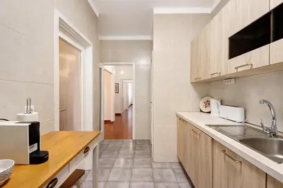 a kitchen with a sink and a counter top at Trindade Porto City Centre in Porto