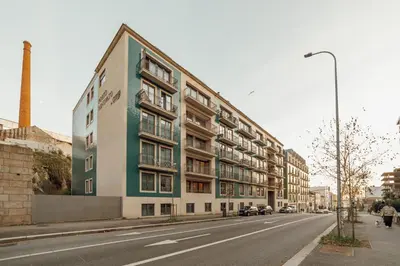 a building on the side of a street at OPORTO GUEST Renovato Luxus Flat w/ parking in Porto