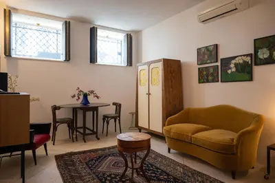 a living room with a couch and a table at Touchy Porto in Porto