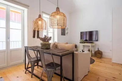 a dining room with a table and two chairs at 157 Flores Apartment in Porto