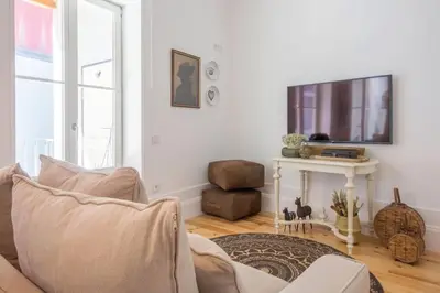 a living room with a couch and a table at 157 Flores Apartment in Porto