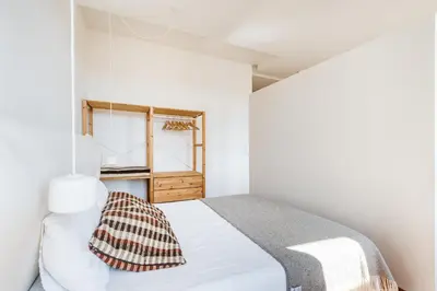 a bedroom with a bed and a window at Hey Apartments C in Porto