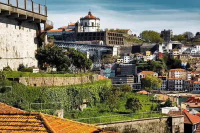 a cityscape of a city with a castle and buildings at Oporto Lovely Apartment in Porto