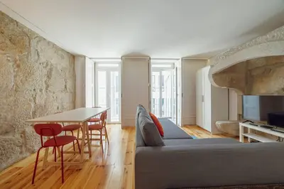 a living room with a couch and a table at Cozy Almada by Hosty in Porto