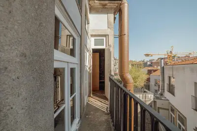 an empty balcony of a building with a pipe at Flores Deluxe by Hosty in Porto