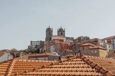 a view of roofs of a city with buildings at Flores Deluxe by Hosty in Porto