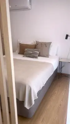a bed with white sheets and pillows on it at Oporto Chic & Cozy - Anibal Cunha in Porto