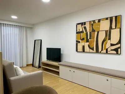 a living room with a couch and a tv at Oporto Chic & Cozy - Anibal Cunha in Porto