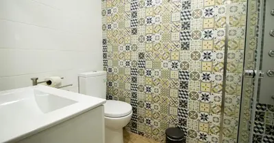 a bathroom with a toilet and a sink at Casa do Recanto - Studio in Porto
