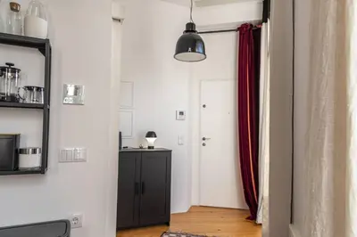 a hallway with a door and a red curtain at Mouzinho Penthouse by Hosty in Porto