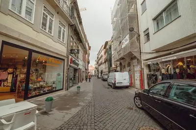 a city street with a car parked on the street at Coliseu Apartment by Hosty in Porto