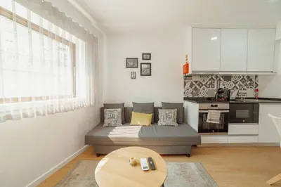 a living room with a couch and a table at Coliseu Apartment by Hosty in Porto