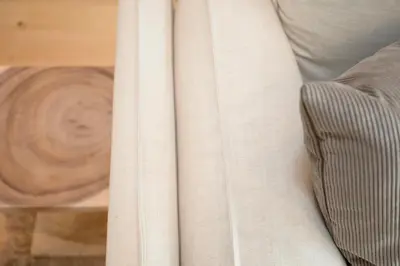 a close up of a white curtain next to a table at NAX Apartments by Liiiving in Porto