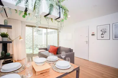 a living room with a table and a couch at NAX Apartments by Liiiving in Porto