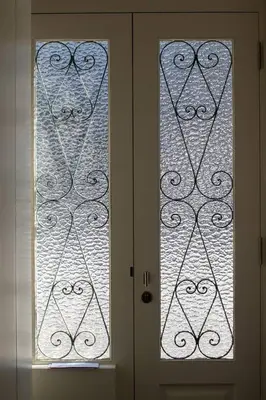 a door with two glass windows in a room at Art Magellan in Porto