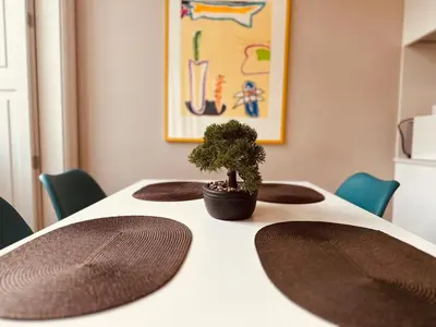 a table with a plant on top of it at Art Magellan in Porto