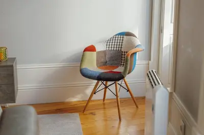 a chair with a blanket on it in a room at Formosa Deluxe by Hosty in Porto