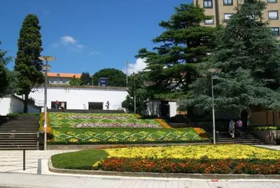 a garden with flowers and stairs in a building at Boavista Charm Balcony Loft in Porto