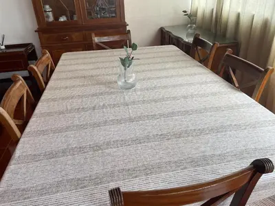 a table with a vase sitting on top of it at Miguel Bombarda Cozy Apartment in Porto