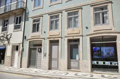 a building on the side of a street at Apartment with balcony in the center of Porto in Porto
