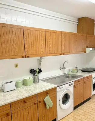 a kitchen with a washing machine and a sink at Oporto Music Flat - Very Central & Free Parking in Porto