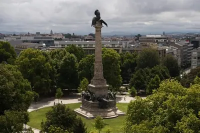 a statue in the middle of a park with trees at Quinta da Boa Vista Garden & Terrace in Porto