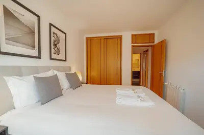 a bedroom with a large white bed with white pillows at Boavista Premium by Hosty in Porto