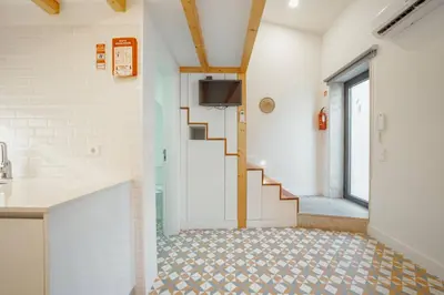 a hallway with a staircase in a room at Lapa Cozy by Hosty in Porto
