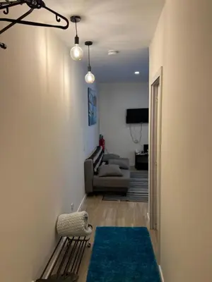 a living room with a couch and a chair at River Place in Porto
