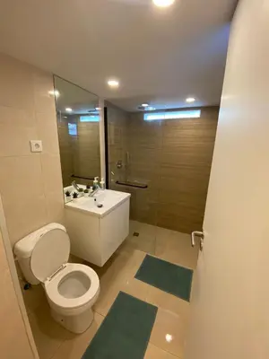 a bathroom with a toilet and a sink and a mirror at River Place in Porto
