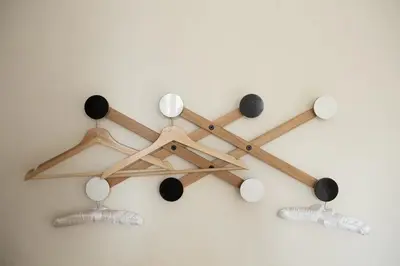 a cluster of wooden chopsticks hanging on a wall at Clerigos Studio Apts in Porto